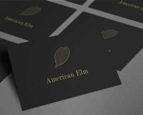 Set of black business cards using Elm illustration for logo