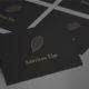 Set of black business cards using Elm illustration for logo