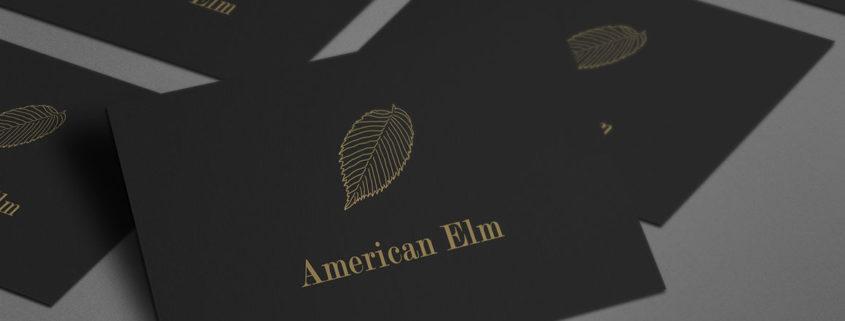Set of black business cards using Elm illustration for logo