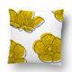 White pillow with yellow floral print pattern