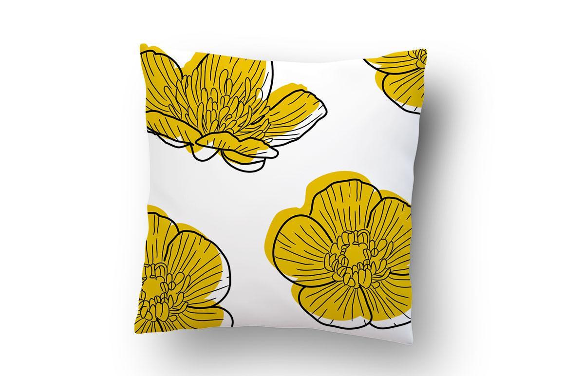 White pillow with yellow floral print pattern