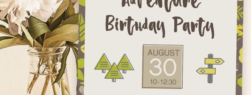 Sample printed birthday party invitation sitting on table next to flowers