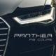 Dark luxury car exterior and headlight with Solia Sans display font overlayed