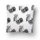 White pillow with black cherry print pattern