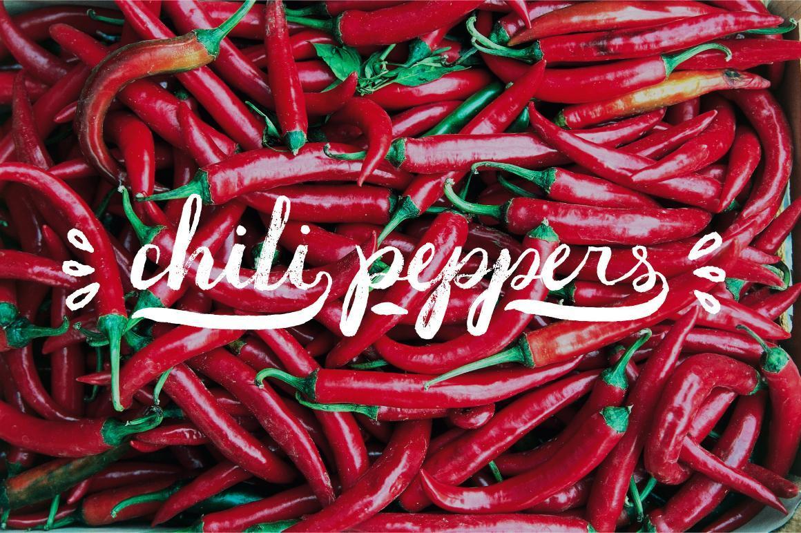 Pile of red chili peppers with text overlayed