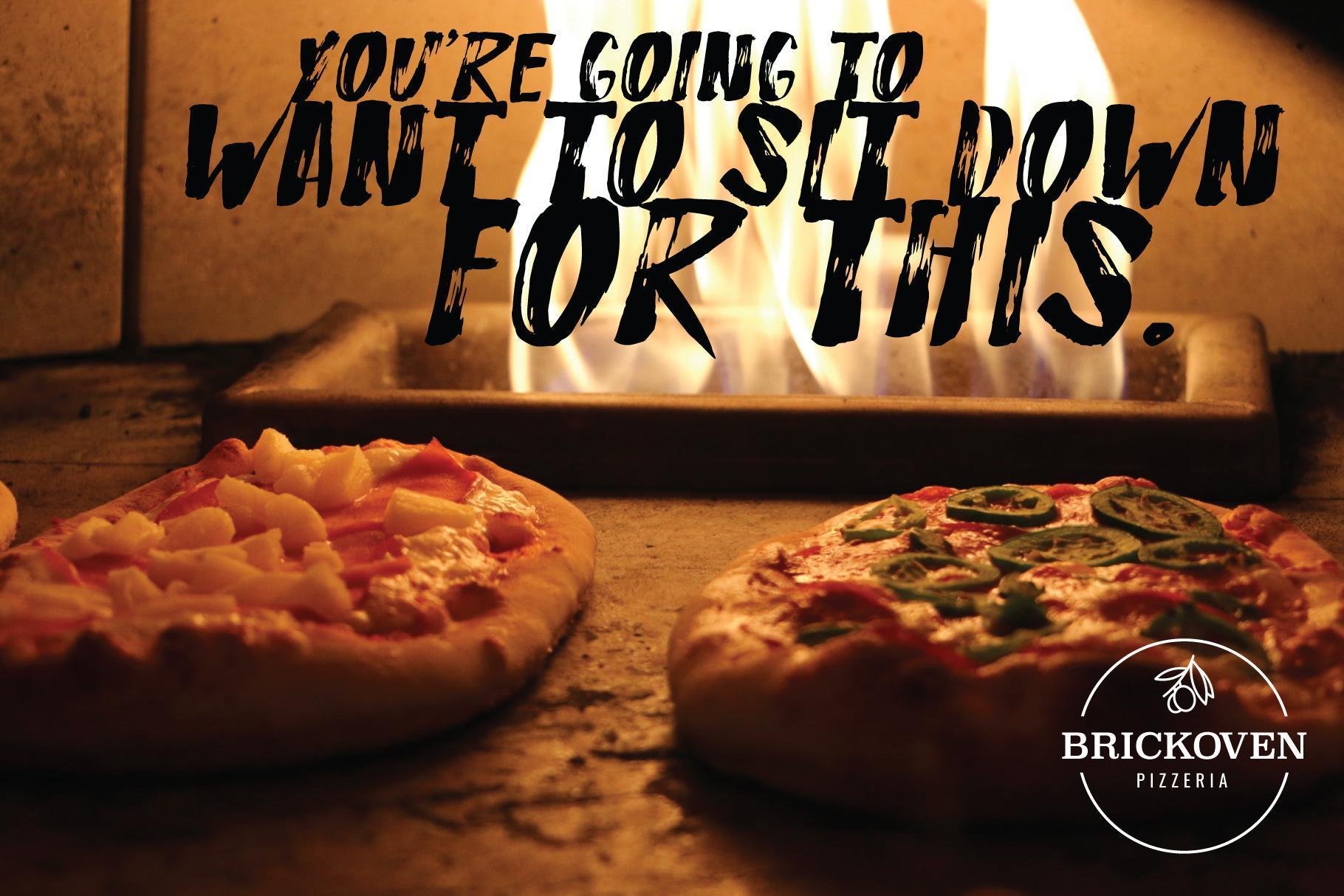 Pizza in front of brick oven
